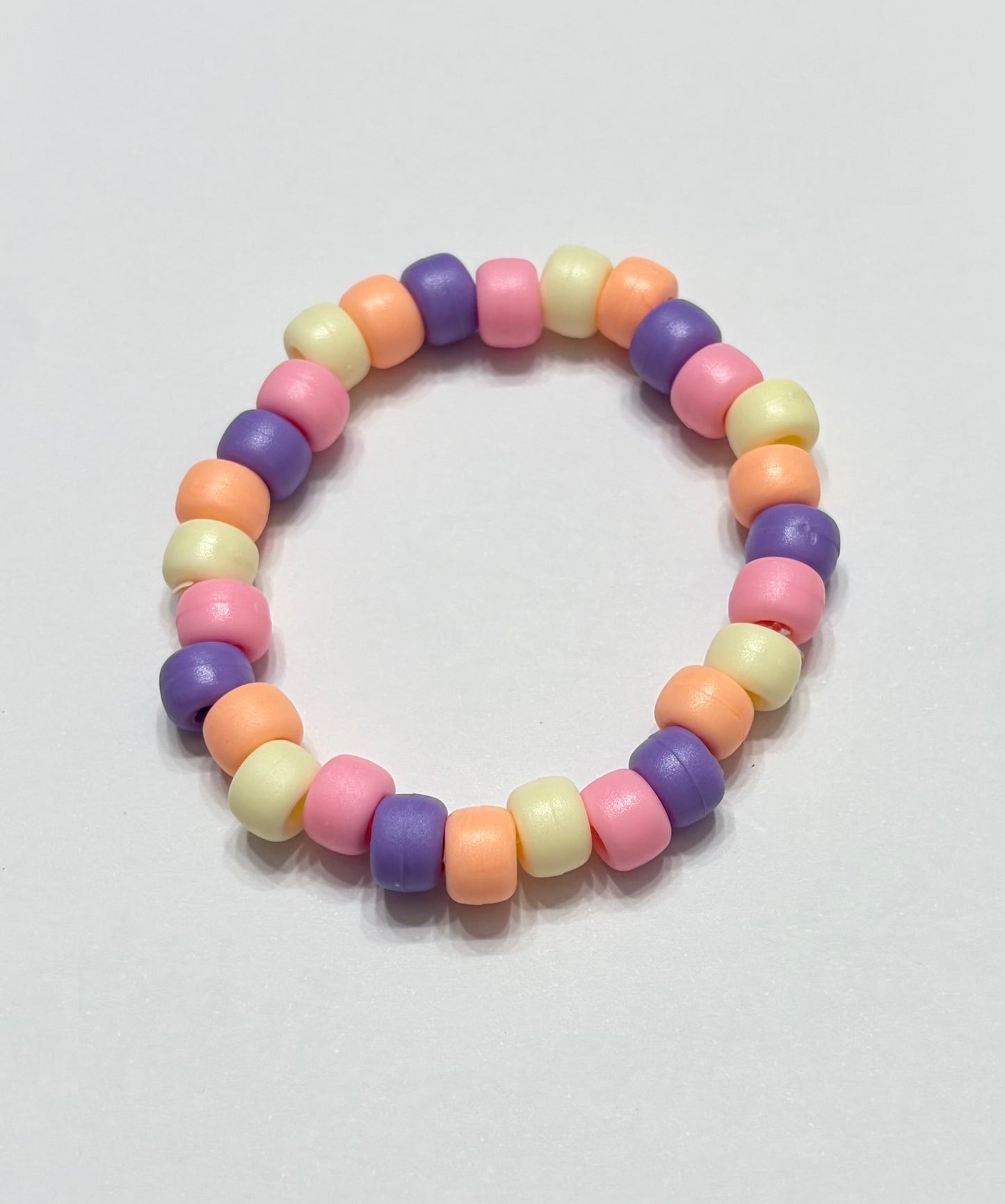 Light orange, light yellow, light, pink, and purple pony beads