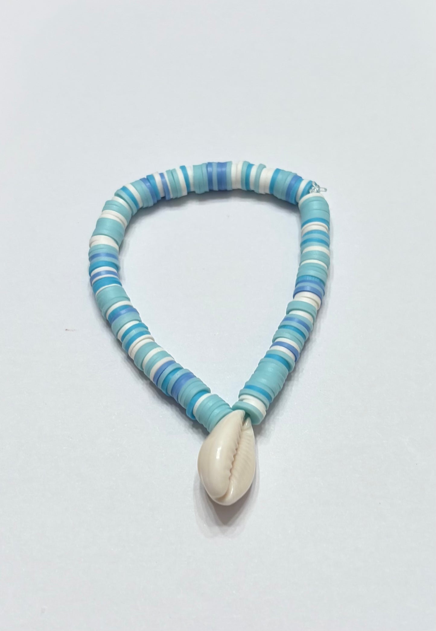 Blue and white mixtures with seashell in the middle