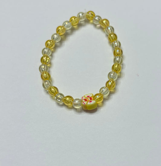 Yellow beads with a yellow butterfly bead in the middle