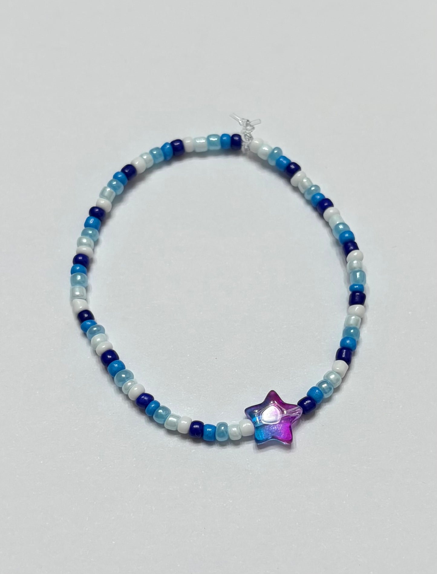 Dark blue to white with blue and purple ombre star in the middle