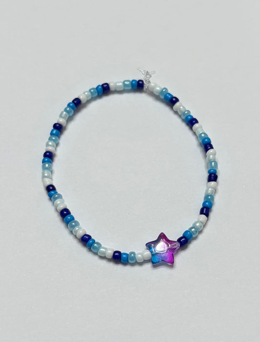 Dark blue to white with blue and purple ombre star in the middle