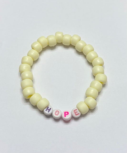 Light yellow pony beads with the word hope