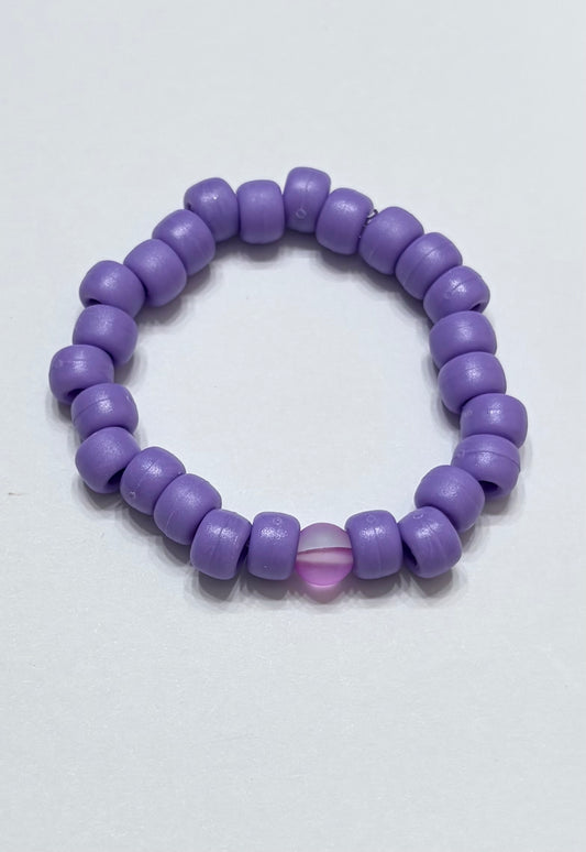 Purple pony bead with purple glow bead in the middle